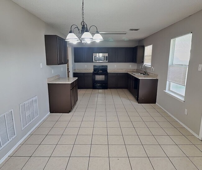 Building Photo - Corner Lot Charmer with Two-Story Deck and Bonus Game Room!