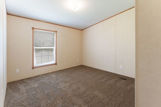 Building Photo - 202 Wild Flower Dr