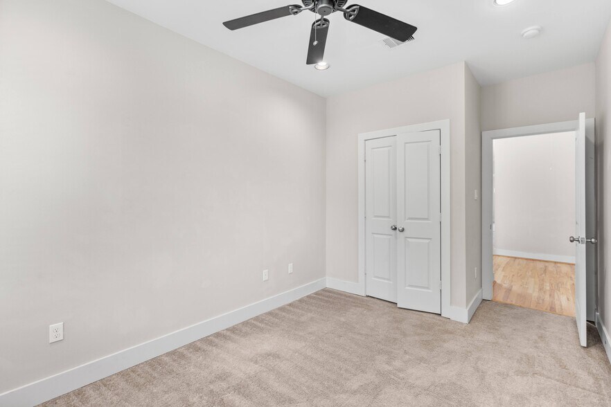 One of two identical secondary bedrooms with large closet and built in shelving each - 1221 W 23rd St