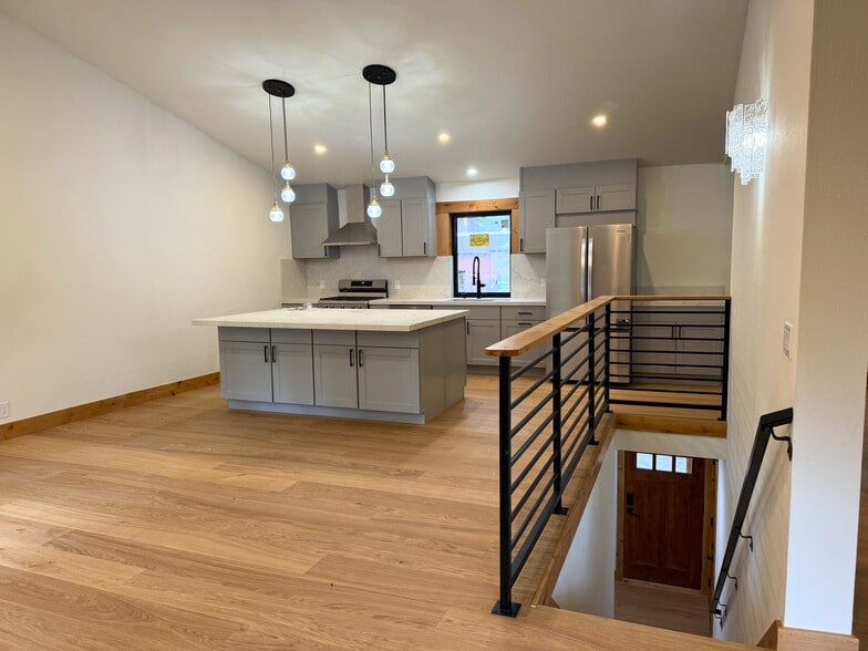 Kitchen Island and stairs - 1029 Tomahawk Trl