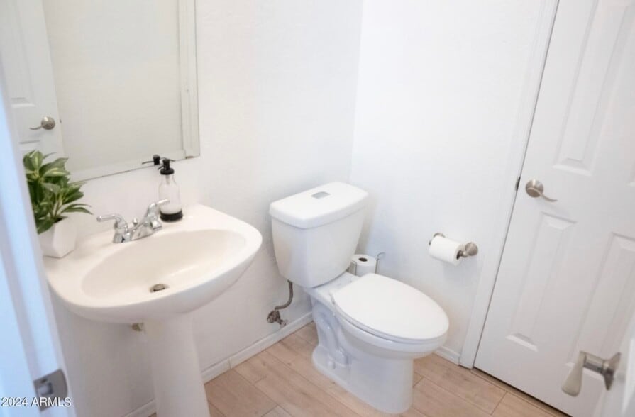 Half bathroom on first floor with storage closet - 66 E Saddle Way