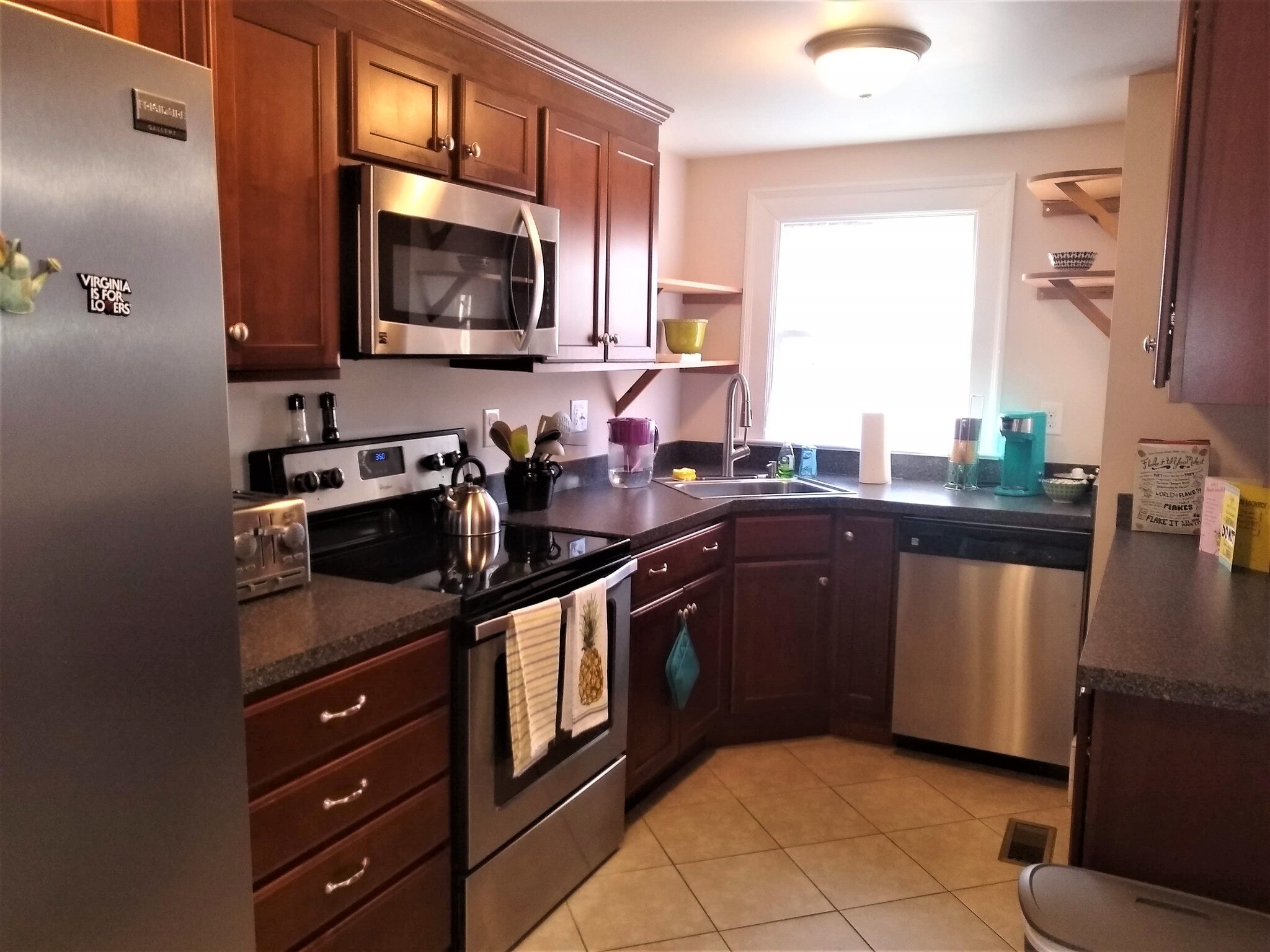 Renovated kitchen with cherry cabinets - 205 Douglas Avenue