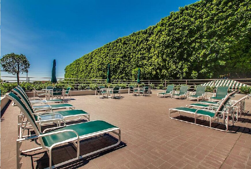 The spacious sun patio, which also has a grill and patio tables for eating - 1131 Alta Loma Rd