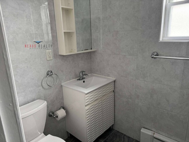 Building Photo - 21-44-44 71st St