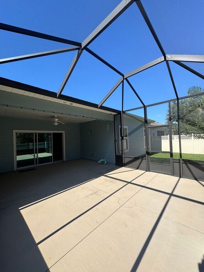 Building Photo - COMING SOON! Beautiful 4BR 3BA Home w/ Screened Lanai & Pond View • Garage Parking • Fenced Yard ...