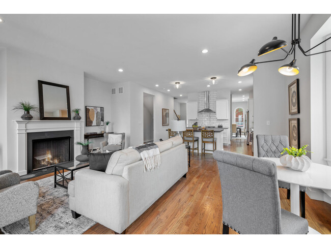 Great room features a gas fireplace, bistro bay window seating and walk out to deck overlookin gthe - 2245 Hickory St