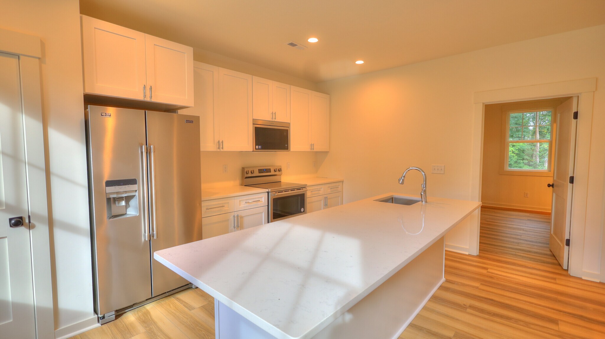 Untit A -Chef's kitchen with eat in island, quartz countertops and stainless appliances. - 345 W Stewart Ave