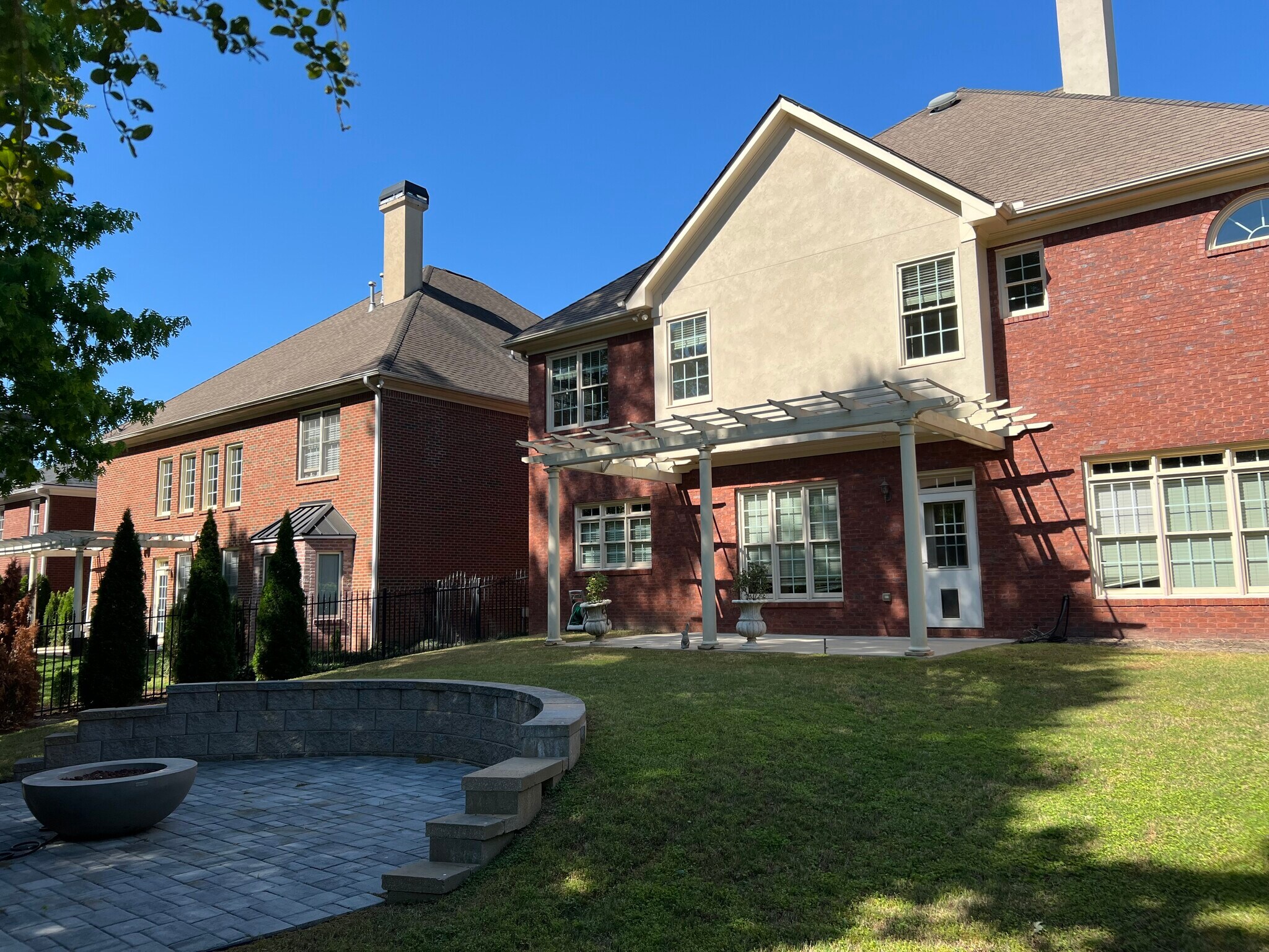 Fenced backyard with fire pit - 440 Wembley Cir