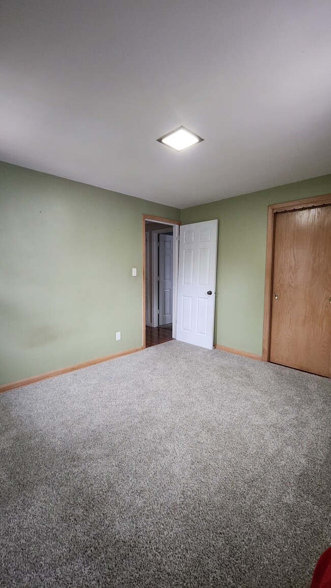 First floor bedroom #2 with closet. - 1718 S Walden Ave