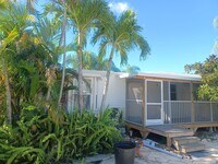 Building Photo - COMING EARLY JUNE: ISLAND LIVING IN BOKEELIA: 1 BD / 1.5 BR Front Screened Lanai