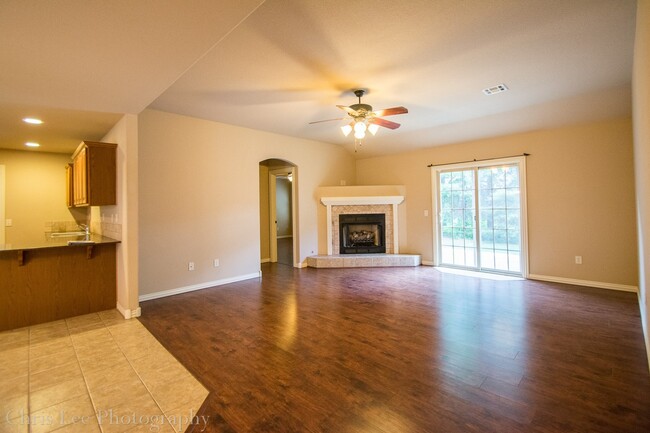 Building Photo - Three bedroom Home with Hardwood Floors Th...