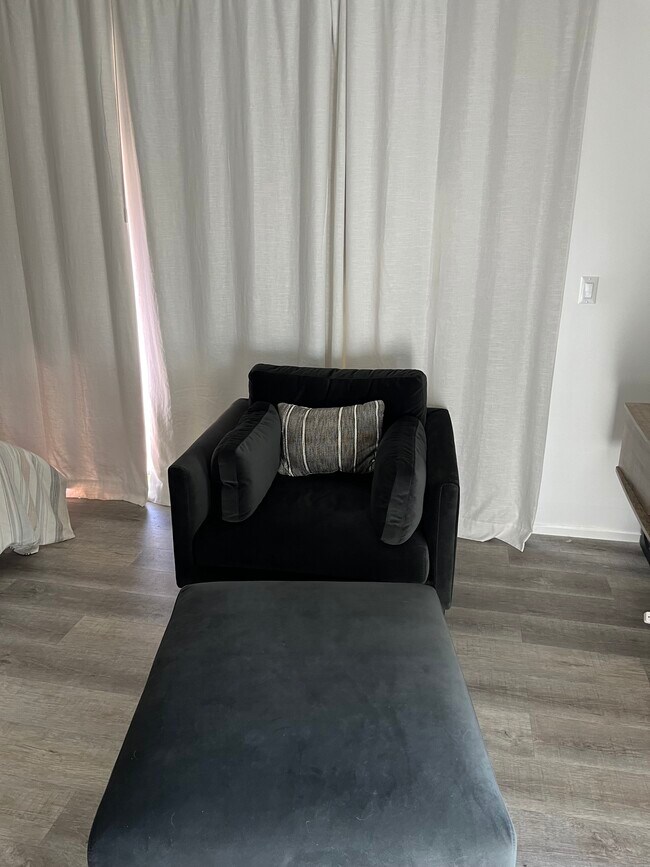 Chair and ottoman - 12131 Huston St