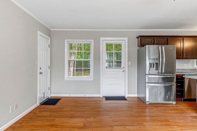 Building Photo - Updated Home, Stainless Steel Appliances, Wood Like Flooring, Deck, Garage!