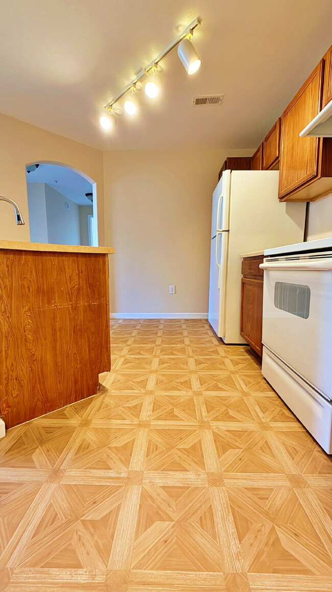 Building Photo - NEW CARPET NEW PAINT!! Clean and Bright 2BR 2BTH Condo Close To DIA. Gated Community in First Cre...