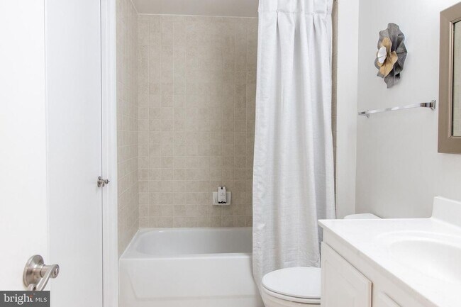 Building Photo - Bright 1BR with Parking Included, Minutes from The Wharf!