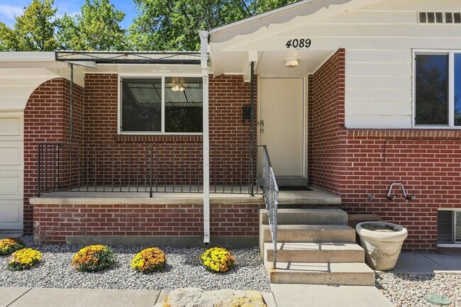 Building Photo - AVAILABLE NOW  Spacious 4-Bedroom Wheat Ridge Home with Finished Garden Level, Two-Car Garage & B...