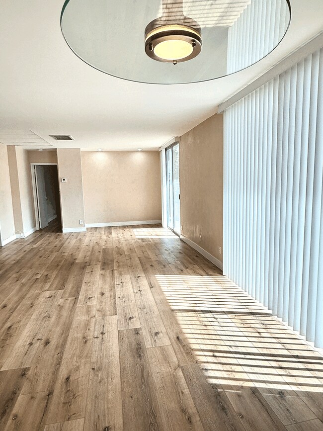 Living room area from Dining Area - 100 S Doheny Dr