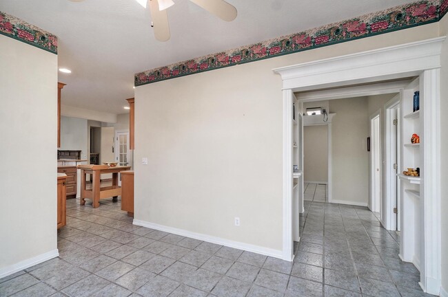 dining room - will be repainted and boarder wallpaper removed - 4907 S Buckingham Ln