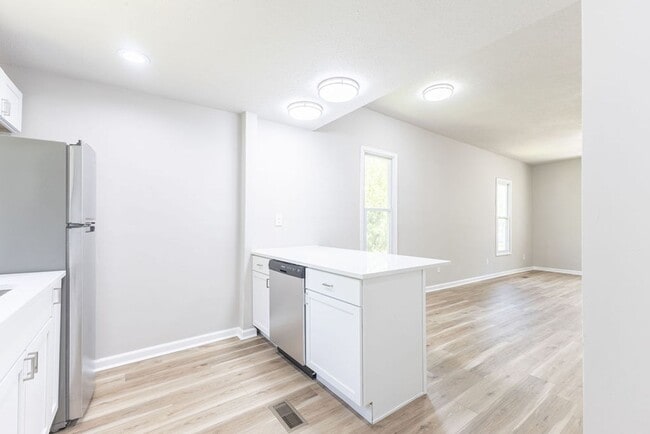 Building Photo - Remodeled 2-Bedroom Bungalow with Spacious Yard & 1-Car Basement Garage
