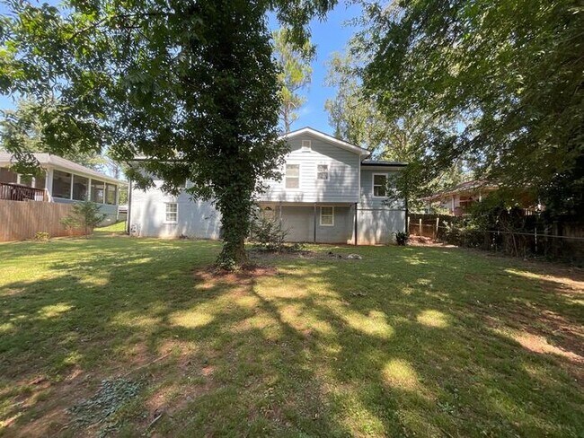 Building Photo - **Spacious 4BR with Modern Upgrades & Cove...