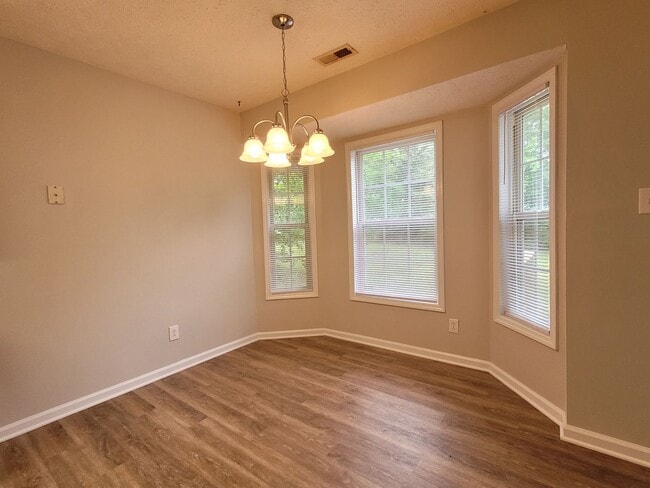 Building Photo - LVP floors, Large Yard!  3 BRM, 2 BHs, Double Garage!