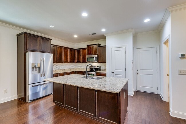 Building Photo - Welcome to this charming end unit townhome