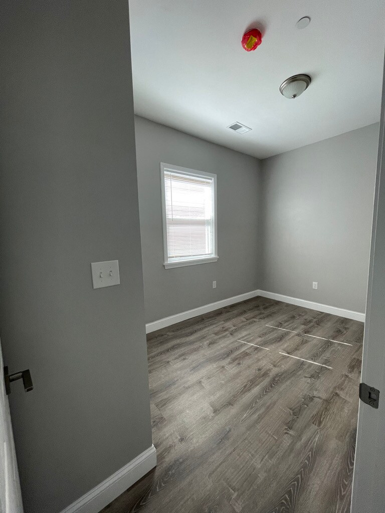 Unit two: bedroom two with closet and easy-clean window with child-safe blinds. - 34 Falcon St