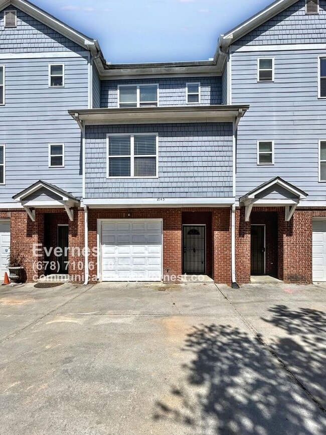Primary Photo - Spacious 4-Bedroom Townhome with Modern Co...