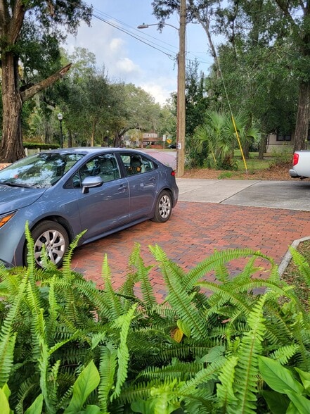 Brick overflow parking for 2 additional vehicles - 1210 E Jackson St