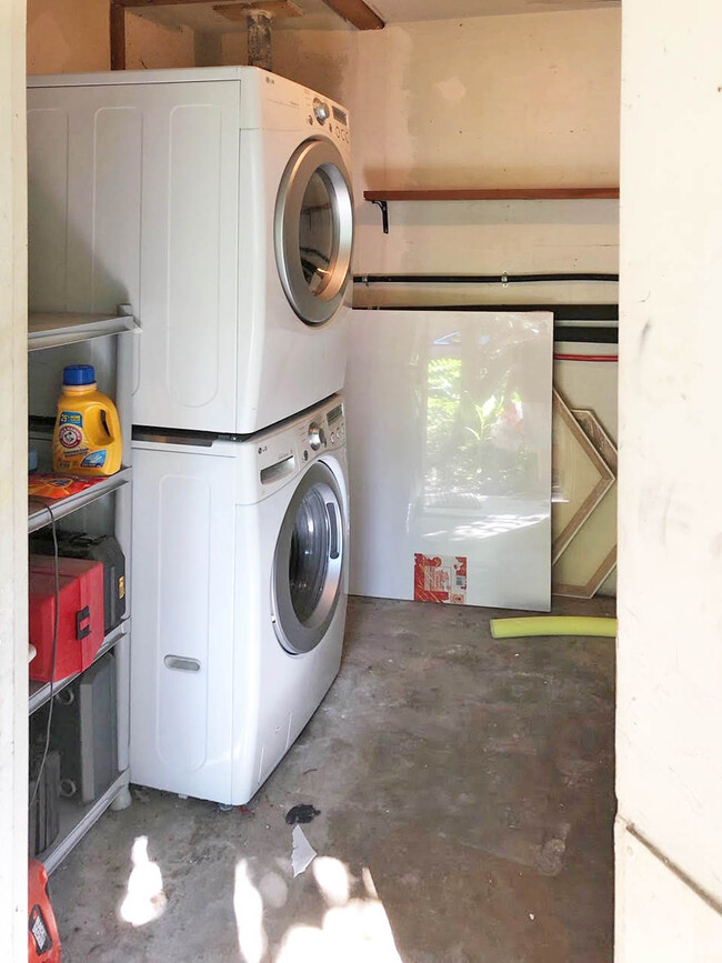 Stacked washer/dryer are included, and this utility room has some great storage space to boot - 1602 Valleyridge Dr