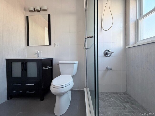 Building Photo - 210-10 56th Ave