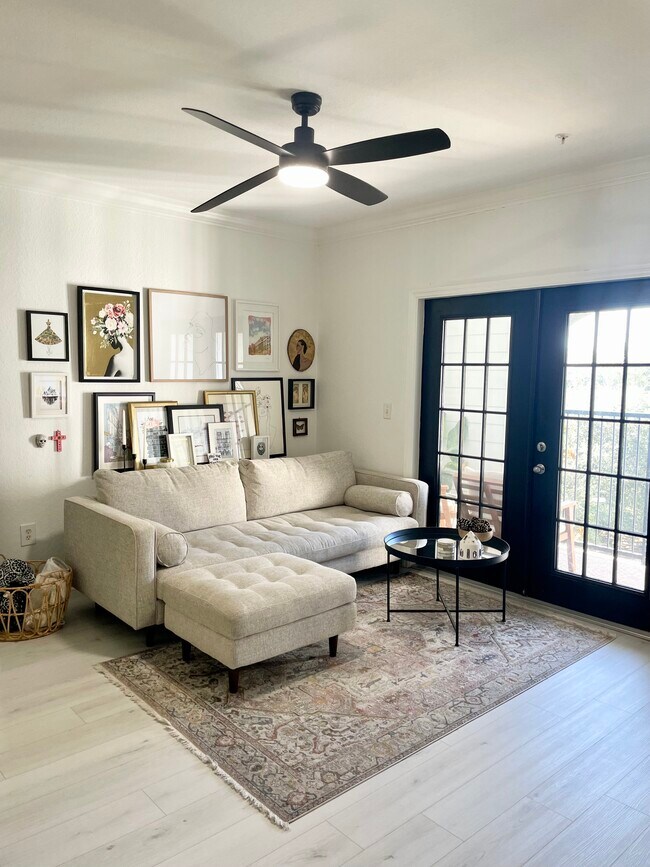 Lots of natural light from the private balcony (furniture not included) - 304 E South St