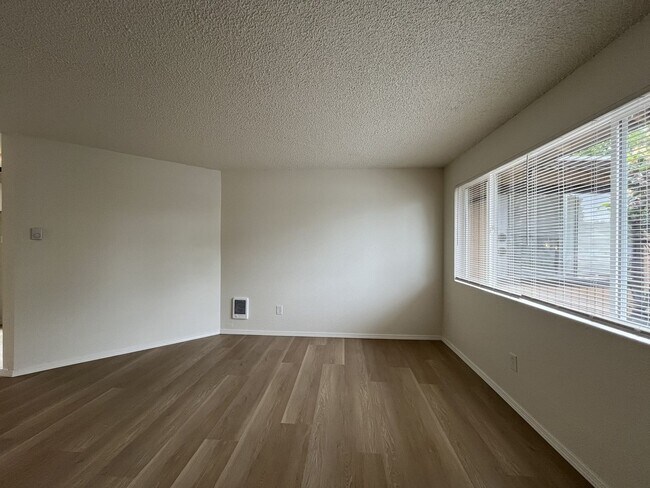 Building Photo - Inviting 2 Bedroom Home with Open Layout, Stainless Steel Appliances & Private Outdoor Retreat