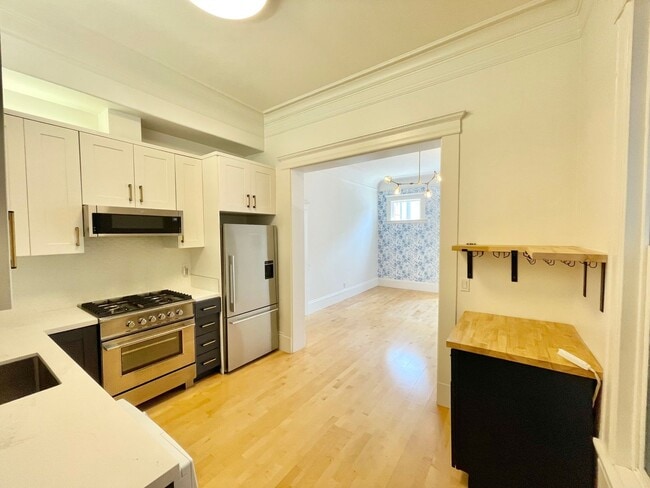 Building Photo - Super Charming NOPA Condo! Parking! Laundr...