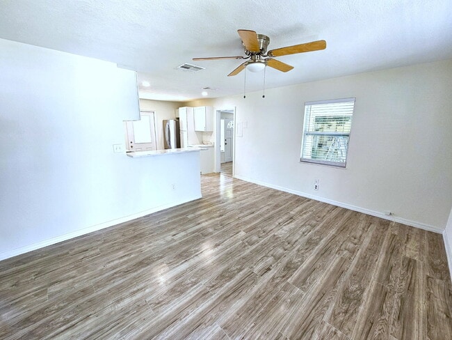 Building Photo - fully renovated 2-bedroom, 1-bathroom home with bonus guest room or office and oversized fenced yard