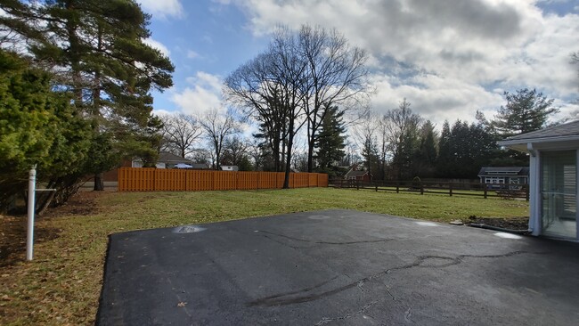 View of partially fenced backyard (It's larger than it looks in this pictire) - 6934 Winding Way