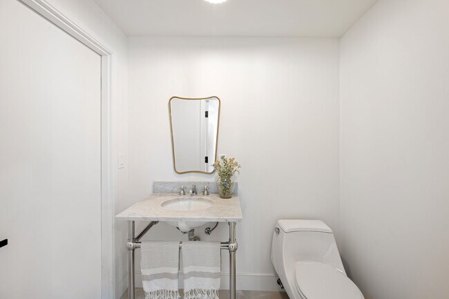 Powder room downstairs with access to living area and downstairs bedrooms - 518 Euclid St