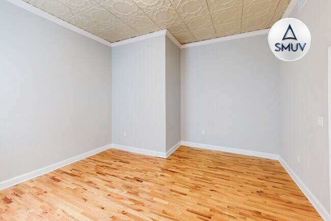Building Photo - 100 West Lexington-209