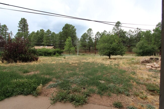 Building Photo - COMING AUGUST | 3-Bedroom Home in Bow & Arrow Acres | Large Yard + Wood-Burning Fireplace