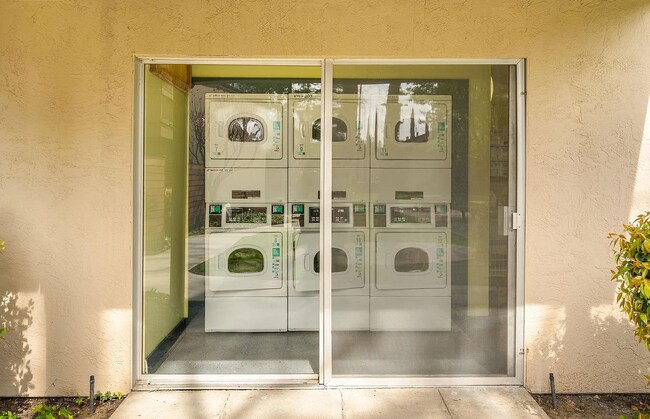 Building Photo - The updated bathroom offers a shower-over-...