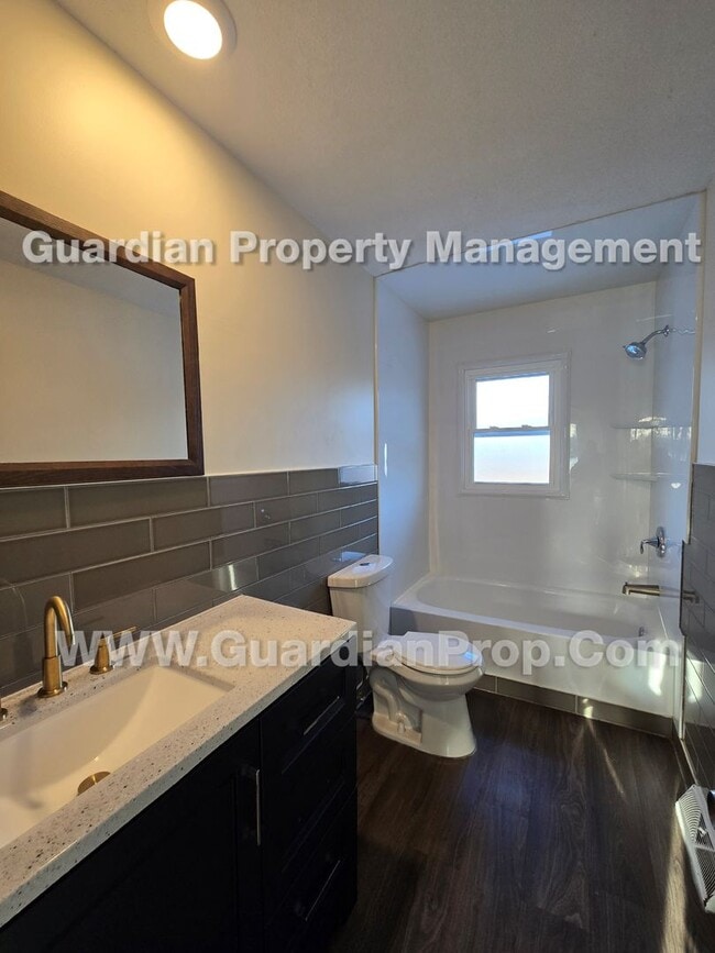 Building Photo - duplex unit available now! LVP flooring throughout, independent living areas each W/ full kitchen...