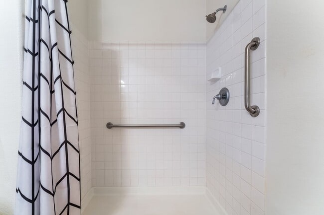 Building Photo - Charming Ground-Floor Condo with Wood Flooring & Modern Comforts!