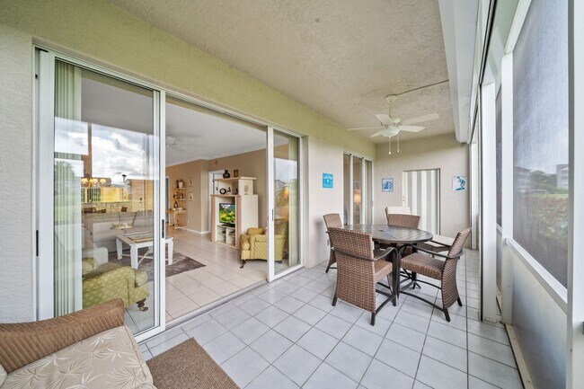 Building Photo - first-floor unit featuring a 2 bedroom, 2 bath fully furnished