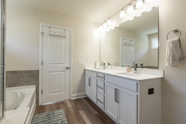 Building Photo - "Discover Spacious Living: 5-Bedroom Craftsman Home in Gated and Amenity-Rich Bretagne with Top-R...