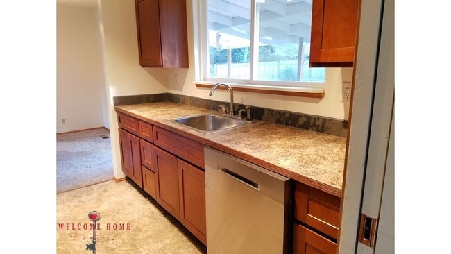 Building Photo - Beautiful Remodeled Rambler!!!  Come enjoy this HUGE backyard!!  NEW CARPET!!