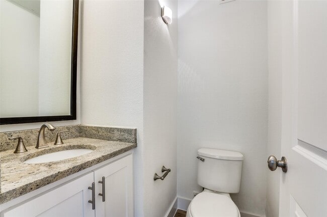 Building Photo - Beautiful townhome featuring granite countertops, hard wood floors, and a small private yard grea...
