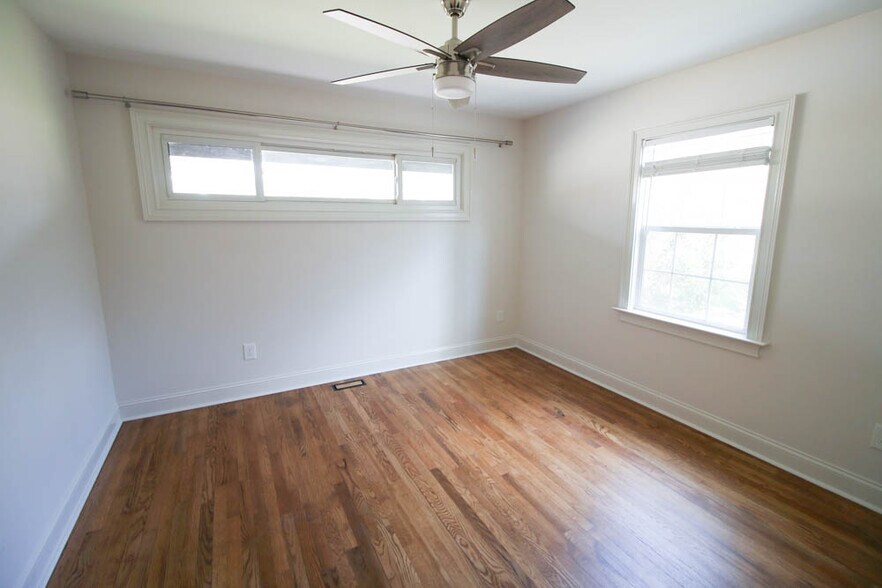 Front light filled bedroom with modern ceiling fan - 2406 Boswell Rd