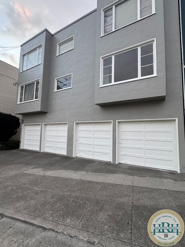 Building Photo - Spacious & Bright 2BR|1BA w/ One Garage Parking Spot Included