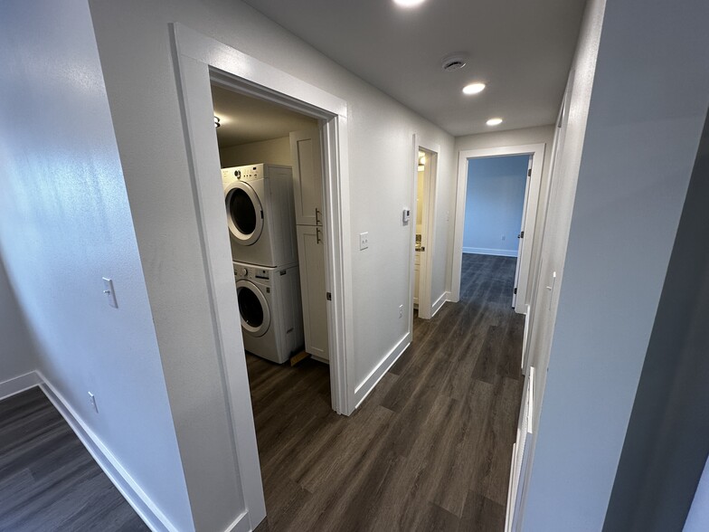Hallway looking at utility room/1st bathroom - 3300 Nashville Ave
