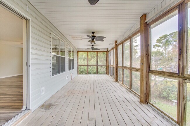 Building Photo - Live the Gulf Breeze Waterfront Life – Dock, Canal Access & Boat Lift!